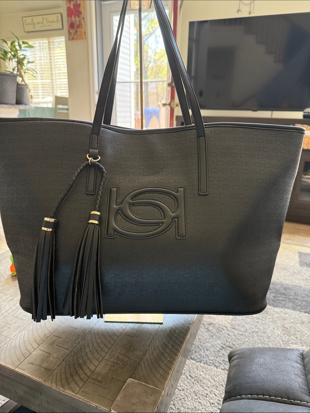 Bebe Women’s Black Leather Tote Bag with Tassel Detail